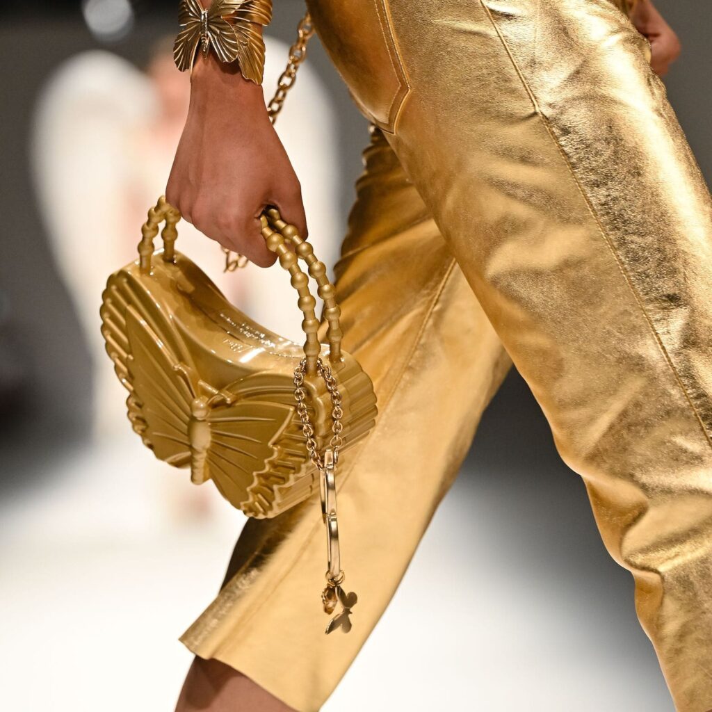 A collection of luxurious golden handbags, a bold and eye-catching choice.
