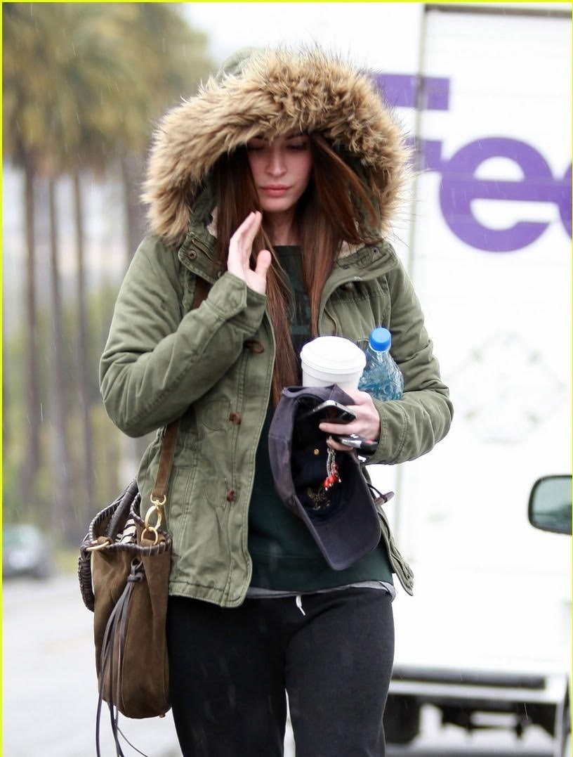 Wrapped in winter layers, I paired Megan Fox's trendsetting nails with an oversized teddy bear jacket and a long black coat. Her red bob peeking out added a vibrant touch.
